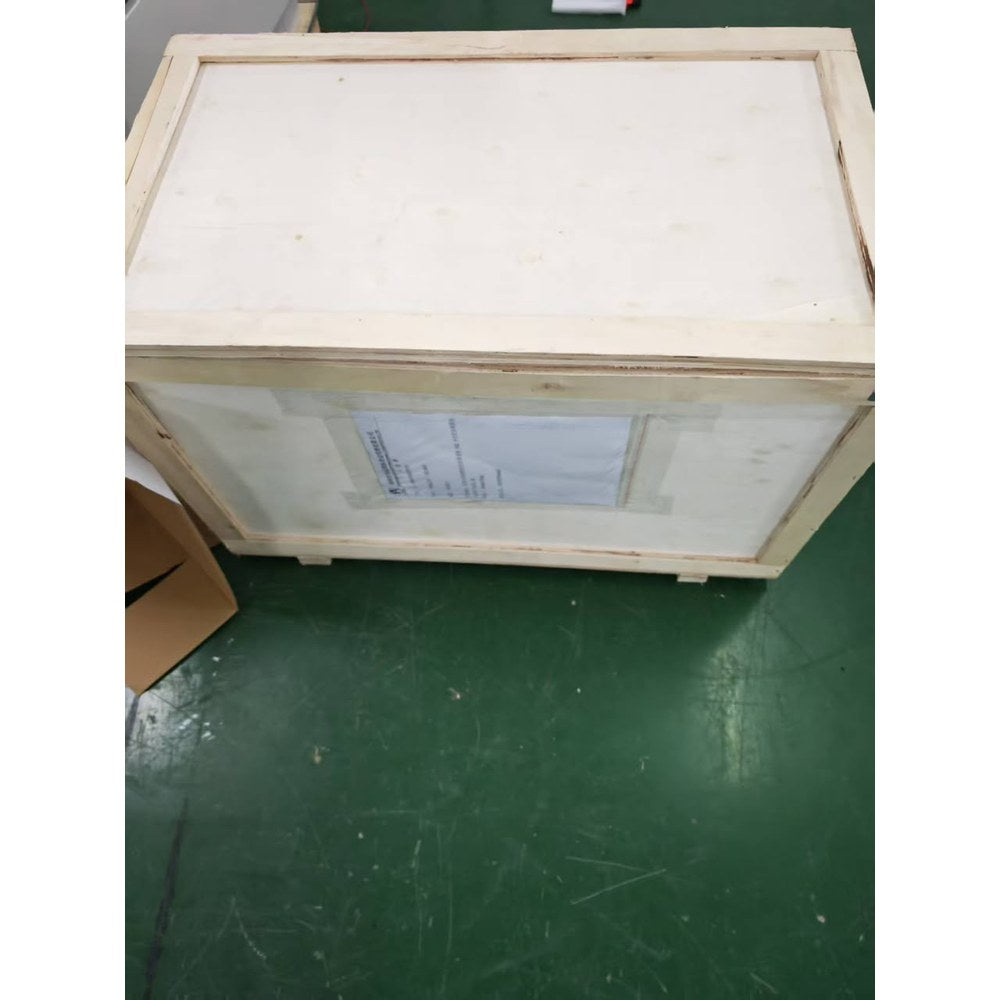 Closed plywood shipping crate for a G-5000 wind turbine with the consignment label taped to its side