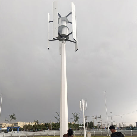H1000 vertical wind turbine on a tall roadside mast with installers at its base