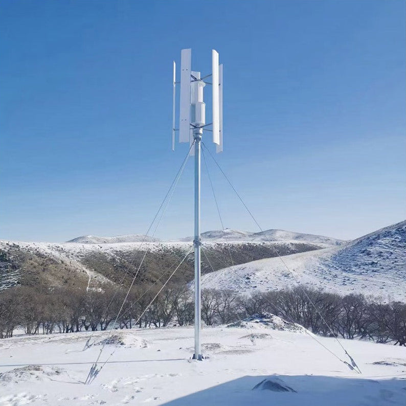 Five-blade H12 vertical axis wind turbine on a guyed mast in snow-covered hill country - representative family photo
