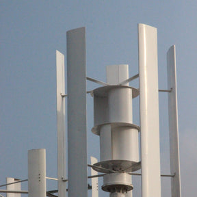 Close-up of the H2000 rotor — tall white aluminium blades around the drum-shaped assist wind wheel