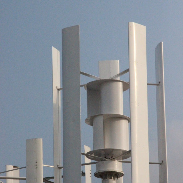 Close-up of the H2000 rotor — tall white aluminium blades around the drum-shaped assist wind wheel