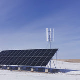 H2000 turbine and a ground-mounted solar array on a snowy plain