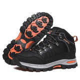 Pair of black lace-up hiking boots with orange heel inset and an orange-and-black rubber lug sole