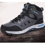 Grey hiking boot side view: metal lace loops, mesh side panels, padded collar and heel pull loop