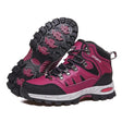 Pair of rose red lace-up hiking boots with black trim and a rose-and-black rubber lug sole
