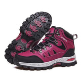 Pair of rose red lace-up hiking boots with black trim and a rose-and-black rubber lug sole