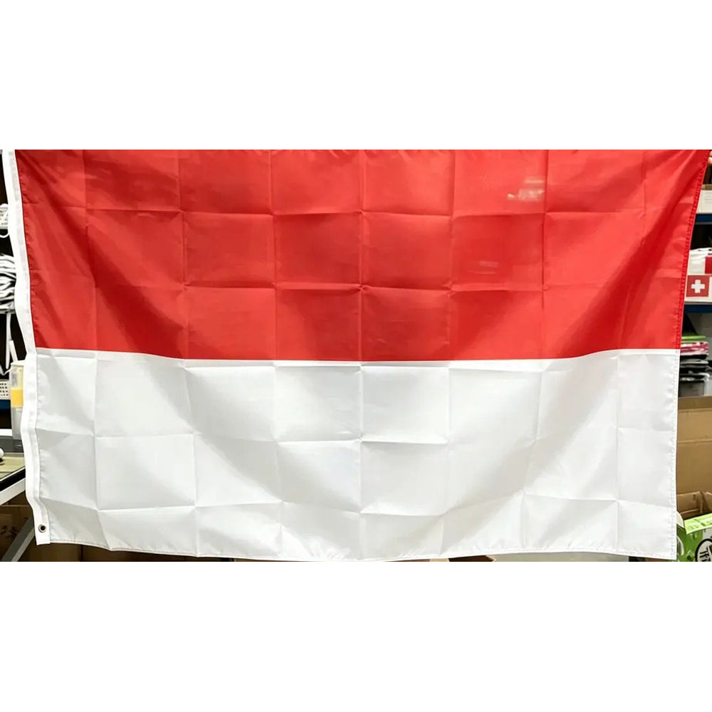 Indonesian flag in printed polyester held up indoors: red over white, white header strip at left
