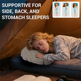 Woman asleep on her side on the inflatable pillow in a tent