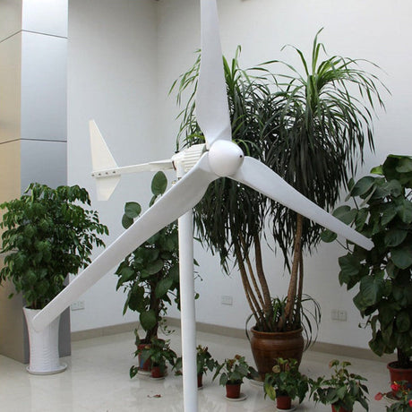 L-series three-blade horizontal-axis wind turbine displayed on a stand indoors among potted plants - representative family photo