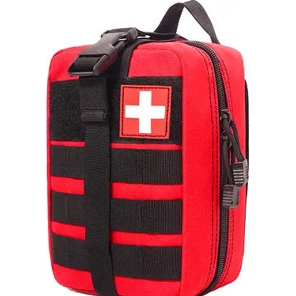 Red MOLLE first aid bag with black webbing, a front buckle strap, a carry handle and a white cross patch