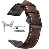 Dark brown waxed leather band with cream stitching and a black buckle
