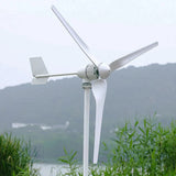 M5-800 close up on its pole: finned generator body, tail fin and three blades, with hills and water soft in the background
