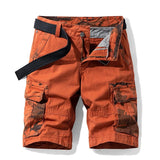 Men's cargo shorts in Orange: orange cotton with brown camo pocket facings and fly, laid flat with a black webbing belt