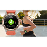 Woman running with the Mibro GS Active on her wrist, inset of the gold watch showing GPS and heart rate