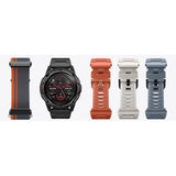Mibro GS Active in black beside the woven nylon strap and the orange, white and grey silicone straps