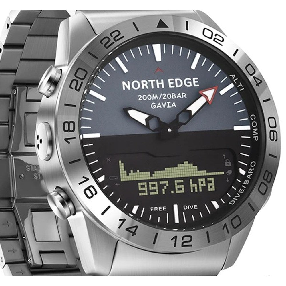 Close view of the North Edge Gavia dial, bezel and left-side buttons on the steel link bracelet