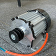 Single-phase permanent magnet generator head with a twin-groove belt pulley, finned aluminium case and orange output cable