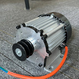 Single-phase permanent magnet generator head with a twin-groove belt pulley, finned aluminium case and orange output cable