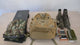 Khaki MOLLE day pack on a table being packed with clothes, a laptop, boots and a phone, then worn by a man in a denim jacket.