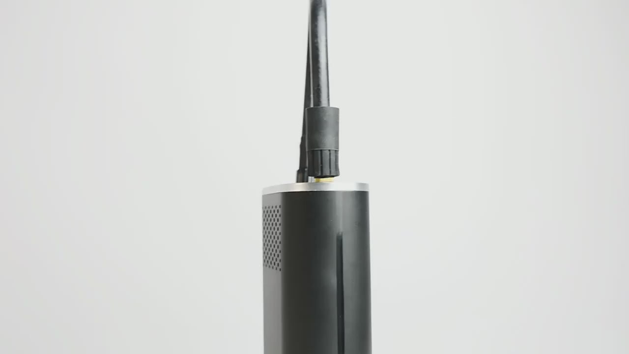The pump's hose screwed onto a car tyre valve, then close-ups of its digital screen and buttons as the pressure is set and the pump is started.
