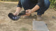 The folding mesh mask and camo cap laid out on the ground after unpacking, then the mask fitted to the cap by hand.