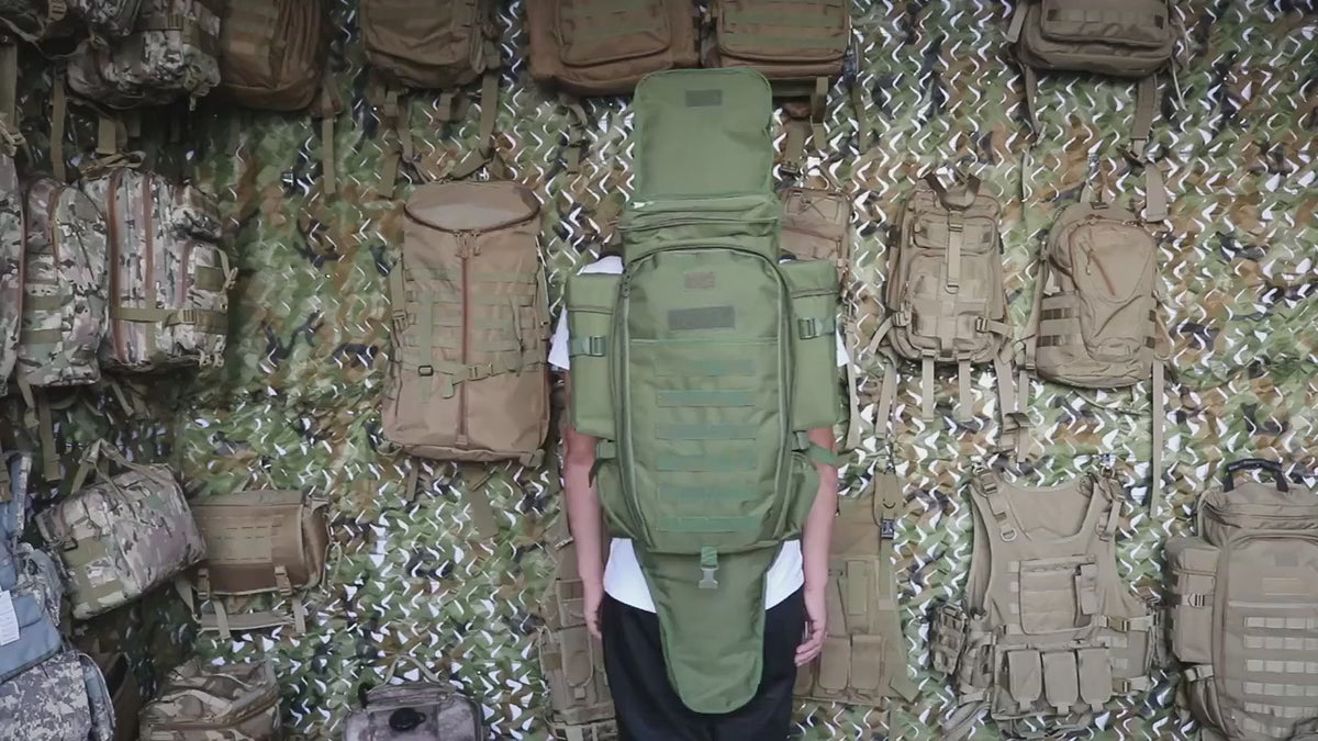 Man turning on the spot wearing the Army Green pack, showing the full-length front sleeve, the side pouches and the shoulder straps.