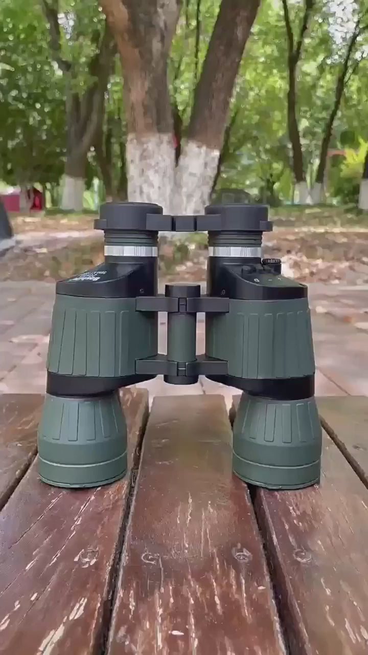 Green Boshile 20x50 binoculars on an outdoor table: the lens caps come off, the eyepieces and the bridge are shown up close.