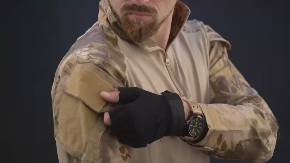 Model in the camo combat shirt and cargo pants showing the sleeves, the collar, the waist and the knee pads.