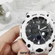 The white SANDA 6030 turned in the hand with its digital readout lit, the back and strap buckle shown close up, then the watch beside black and black-and-gold versions.