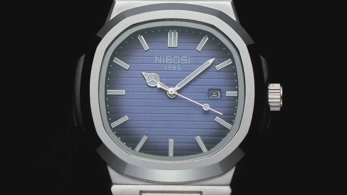 The NIBOSI 2632 with a blue dial and silver steel band turning against black, its hands glowing green in the dark, a close-up of the dial and date window, then the watch on a wrist at a keyboard.