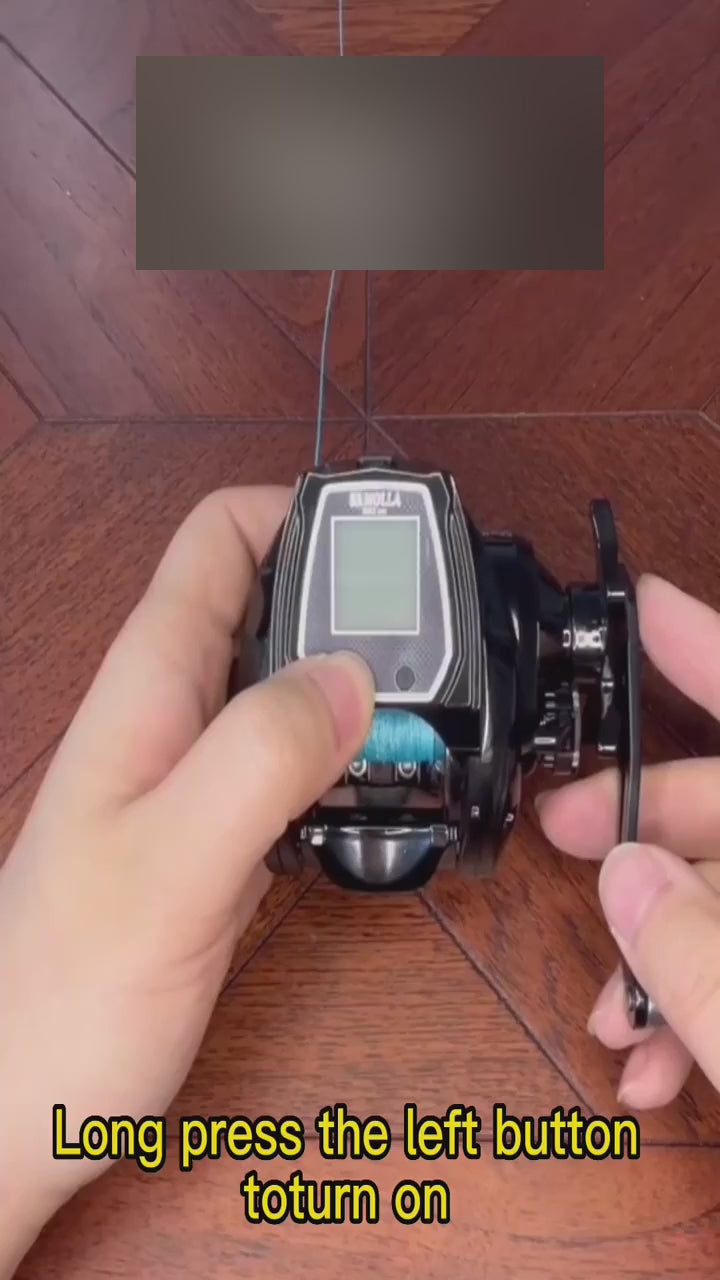 SAMOLLA electronic reel held in the hand, the buttons pressed to show the line counter, the bite alarm and the line-length settings on its screen.