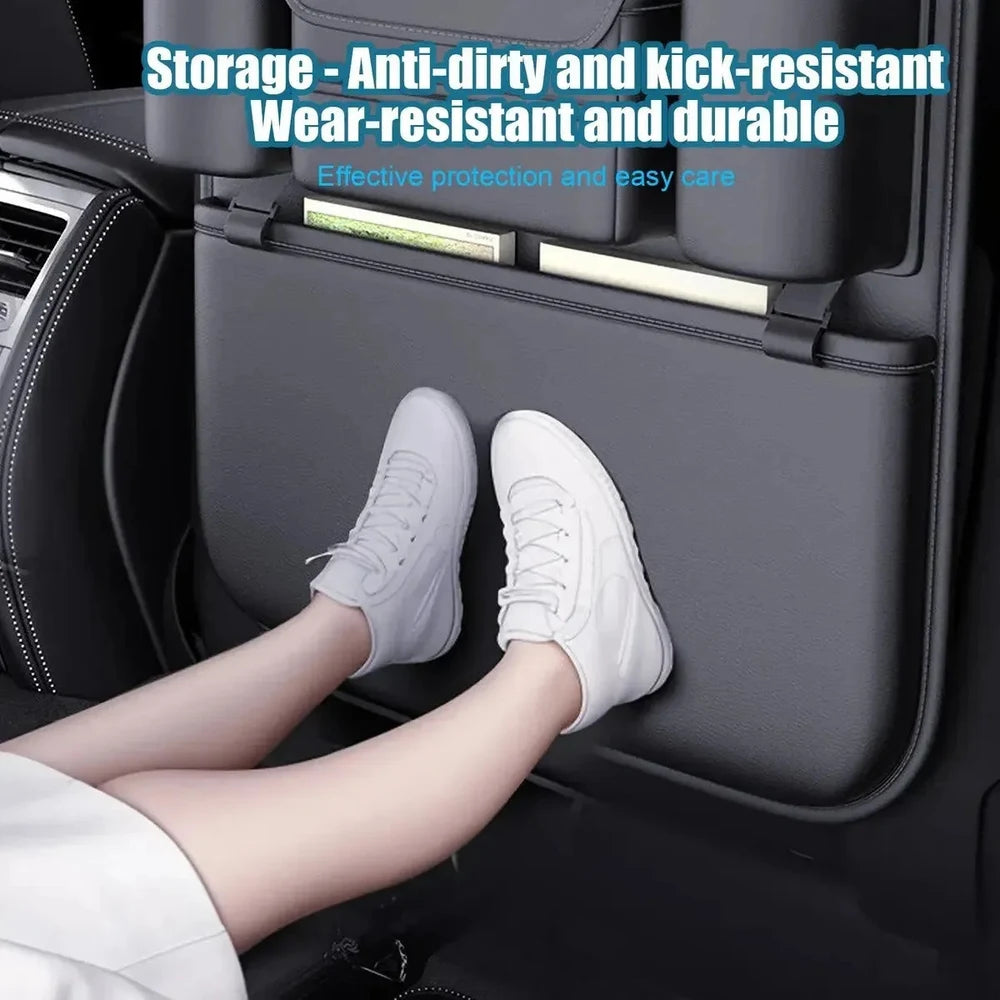 Shoes of a back-seat passenger resting against the PU panel covering the seat back