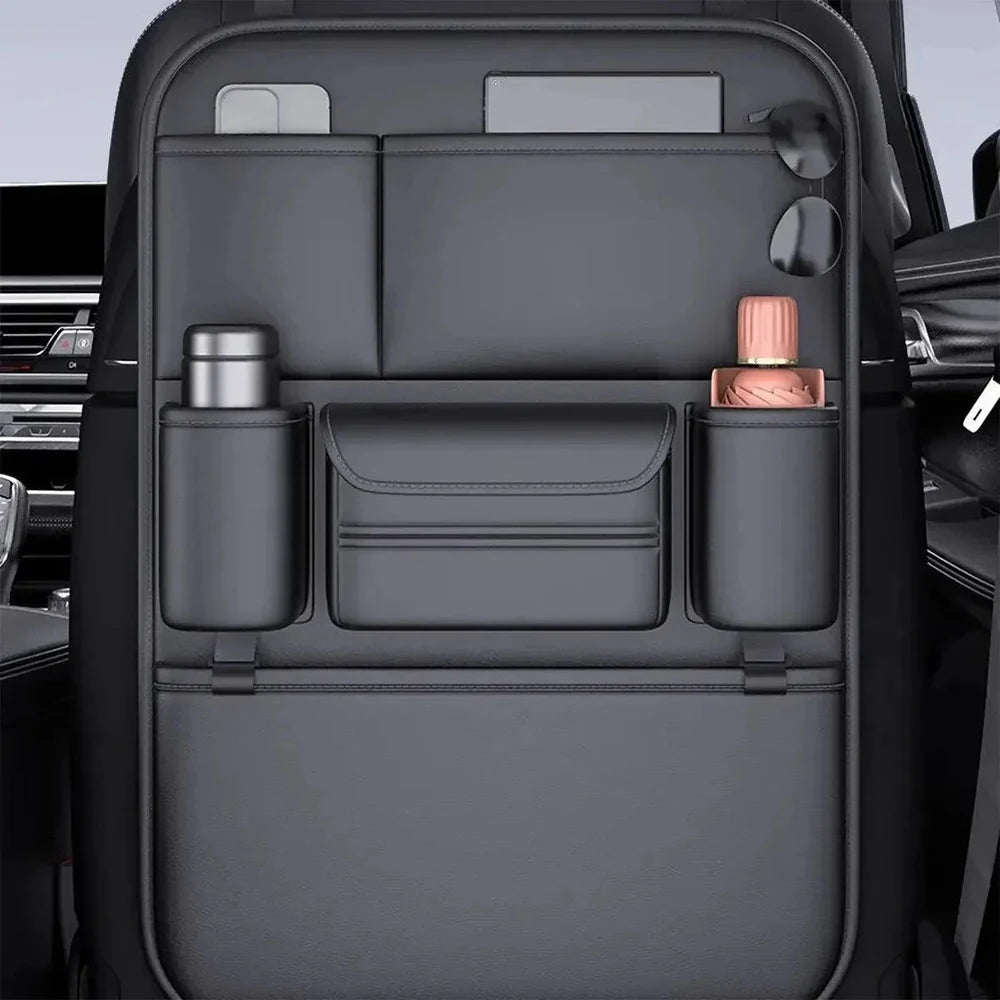 Black PU seat back organiser with a tablet and phone in the top pockets and bottles in the side holders