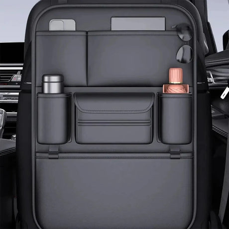 Black PU seat back organiser with a tablet and phone in the top pockets and bottles in the side holders