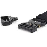 The quick-release buckle pulled apart into its two halves, showing the slot and the tongue with the two gold release levers