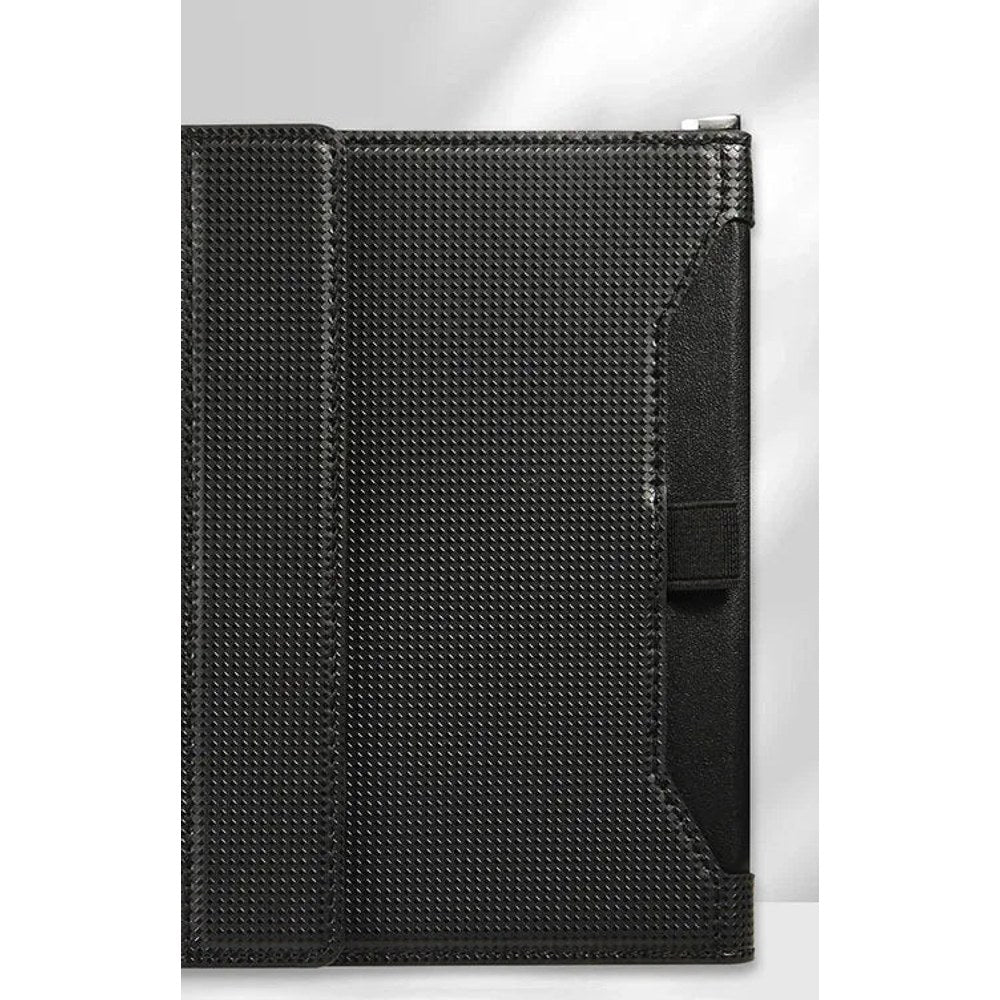 Black passport holder closed, woven-texture cover with an elastic strap and a D-ring at the top corner