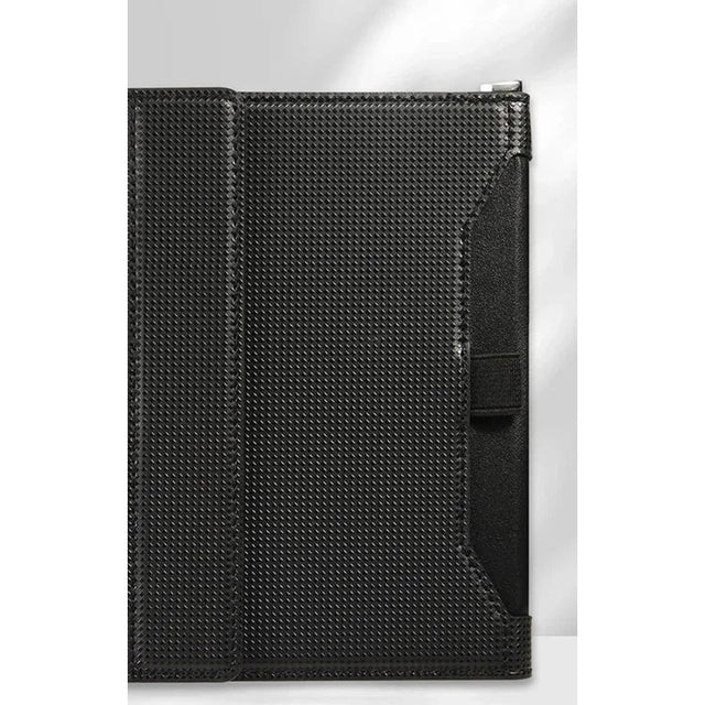Black passport holder closed, woven-texture cover with an elastic strap and a D-ring at the top corner
