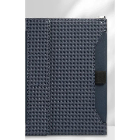 Royal blue passport holder closed, woven-texture cover with a black elastic strap