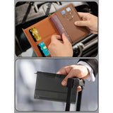 Brown passport holder open in two hands with cards and a passport inside, and the black one held on a suitcase handle
