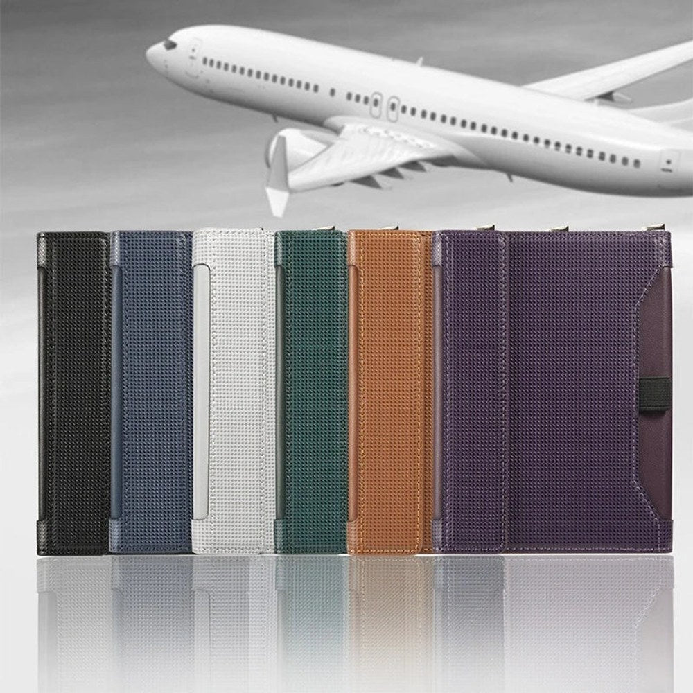 The passport holder in black, blue, grey, green, brown and purple standing in a row