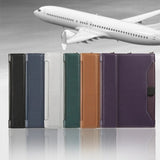 The passport holder in black, blue, grey, green, brown and purple standing in a row