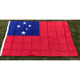 Samoan flag in printed polyester laid flat on grass: red with blue canton and five white stars, header strip at left