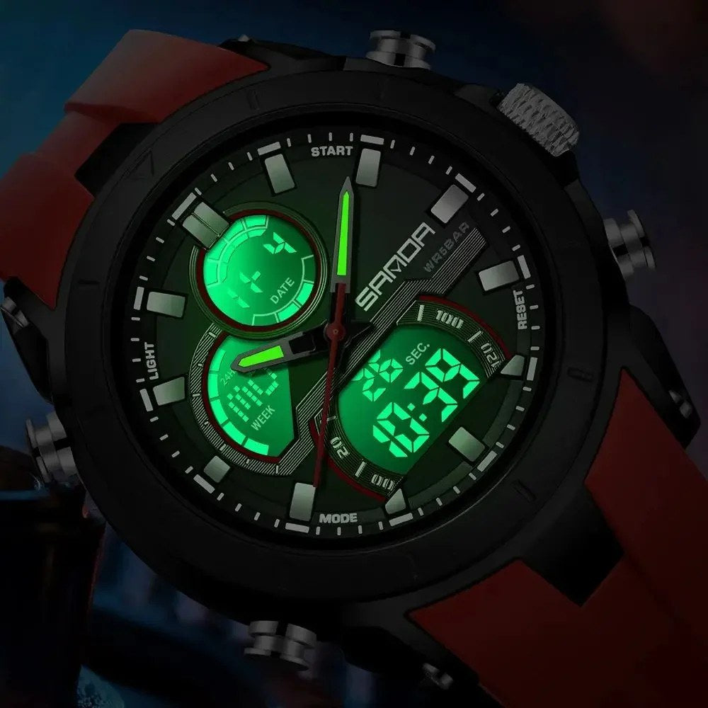 Close-up of the SANDA 6279 dial in the dark with the backlight on and the digital windows lit green