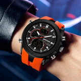 SANDA 6279 watch in orange worn on a wrist, showing its size against a forearm
