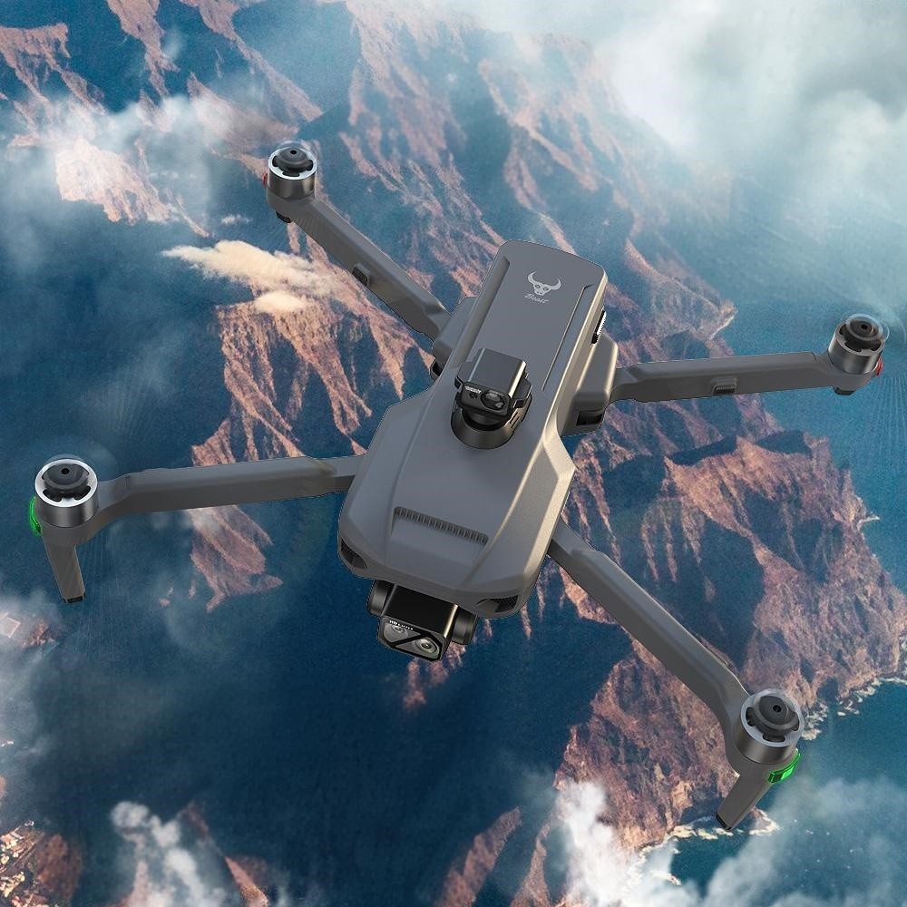 SG909MAX in flight high over a canyon