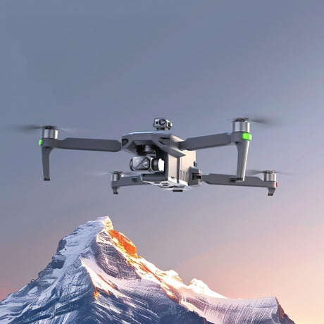 SG909MAX in flight beside a snow-capped peak