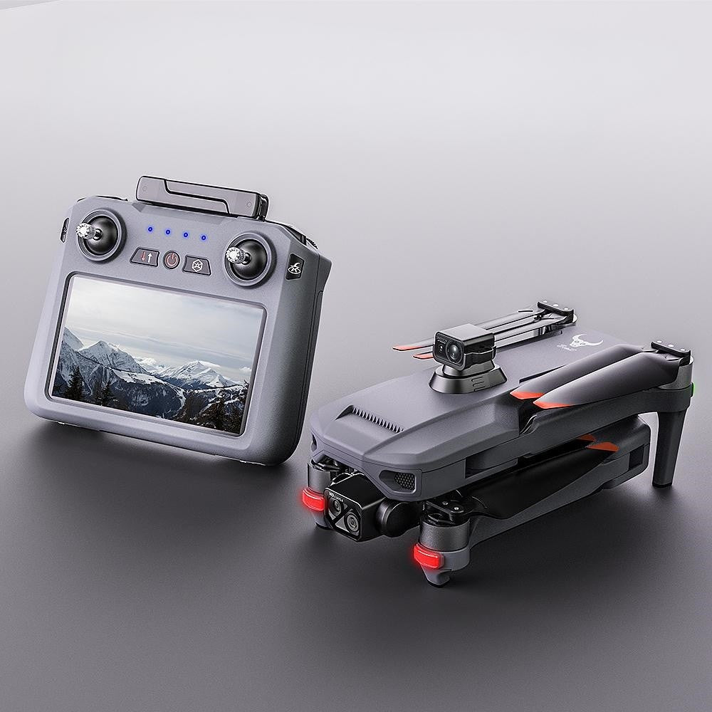 SG909MAX folded drone beside its touch-screen remote, antennas folded flat