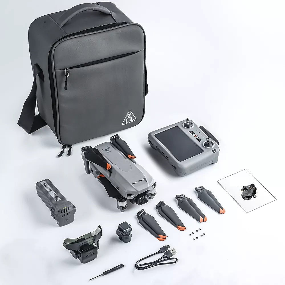 Photo of the SG909MAX kit laid out: carry bag, folded drone, touch-screen remote, battery, obstacle-avoidance module, spare propellers, screws, USB lead, screwdriver and manual