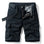 Black01 cargo shorts laid flat, front view, fly open to show the check facing, metal tack button and D-ring on the waistband, with a black webbing belt used for styling
