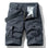 Dark grey RELAX six-pocket cargo shorts laid flat, front view, fly open to show the printed inner waistband, RELAX embroidery on the right cargo flap, with a grey webbing belt used for styling